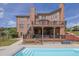 Brick home featuring a back deck and in-ground pool at 2932 Springbluff Ln, Buford, GA 30519