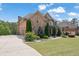 Beautiful brick home featuring a well-manicured lawn and long private driveway at 2932 Springbluff Ln, Buford, GA 30519