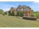 Charming two-story brick and stone home with a well-maintained lawn and landscaping at 2932 Springbluff Ln, Buford, GA 30519