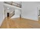 Bright foyer with a wooden staircase, hardwood floors, and a decorative front door at 2932 Springbluff Ln, Buford, GA 30519