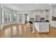 Bright kitchen with white cabinets, granite countertops, stainless steel appliances, and breakfast bar at 2932 Springbluff Ln, Buford, GA 30519