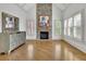 Primary bedroom with stone fireplace, hardwood floors and natural light from shuttered windows at 2932 Springbluff Ln, Buford, GA 30519