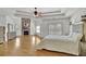 Large primary bedroom with a stone fireplace, hardwood floors and lots of natural light at 2932 Springbluff Ln, Buford, GA 30519