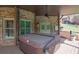 Covered patio features a hot tub and overhead fan at 2932 Springbluff Ln, Buford, GA 30519