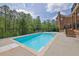 Backyard featuring an in-ground pool surrounded by greenery at 2932 Springbluff Ln, Buford, GA 30519