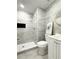 Modern bathroom featuring sleek tiled shower, white vanity, and neutral paint at 2880 Aspen Woods Entry, Doraville, GA 30360