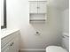 Well-lit bathroom with a white vanity, cabinet, toilet, and brushed nickel hardware at 2880 Aspen Woods Entry, Doraville, GA 30360