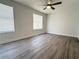 Spacious bedroom with sleek gray flooring, bright windows, and minimalist design at 2880 Aspen Woods Entry, Doraville, GA 30360