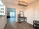 Dining area offering modern lighting, wood-look flooring, and convenient access to the living room at 2880 Aspen Woods Entry, Doraville, GA 30360