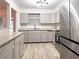 Stylish kitchen featuring stainless steel appliances, light cabinets, and recessed lighting at 2880 Aspen Woods Entry, Doraville, GA 30360