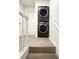 Convenient laundry area with stacked washer and dryer on the upper level at 2880 Aspen Woods Entry, Doraville, GA 30360