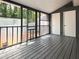 Enclosed porch features wood floors, outdoor access, and natural light at 2880 Aspen Woods Entry, Doraville, GA 30360