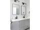 Stylish bathroom featuring double vanity, quartz countertops, and updated fixtures at 3087 Semmes St, Atlanta, GA 30344