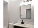 Bathroom features a modern black faucet, white marble countertops, and tiled shower at 3087 Semmes St, Atlanta, GA 30344