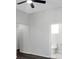 Spacious bedroom with views of a bathroom and door, illuminated by a ceiling fan at 3087 Semmes St, Atlanta, GA 30344