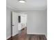 A bright bedroom with hardwood floors leads to a modern kitchen space at 3087 Semmes St, Atlanta, GA 30344