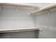 Organized closet featuring wooden shelves and rods for easy storage at 3087 Semmes St, Atlanta, GA 30344