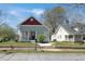 Charming home featuring a red door, red roof and a well-manicured front yard and inviting curb appeal at 3087 Semmes St, Atlanta, GA 30344