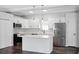 Bright kitchen with island, stainless appliances, and white cabinets at 3087 Semmes St, Atlanta, GA 30344