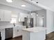 Bright kitchen with island, stainless appliances, and modern lighting at 3087 Semmes St, Atlanta, GA 30344
