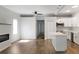 Open-concept living area with modern fireplace and island-style kitchen at 3087 Semmes St, Atlanta, GA 30344