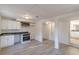 Finished basement with kitchenette area features new appliances, flooring, and bathroom, offering an open plan concept at 4639 Hardwood Rd, Stone Mountain, GA 30083