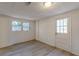 Finished basement area with wood-look flooring, outside access, natural light, and white paneled walls create a welcoming space at 4639 Hardwood Rd, Stone Mountain, GA 30083