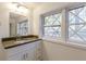 Bathroom features modern vanity, updated window, and large mirror, creating a relaxing and inviting space at 4639 Hardwood Rd, Stone Mountain, GA 30083