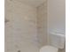 Updated bathroom with marble tile, rain shower head, and modern toilet offer a luxurious and relaxing bathing experience at 4639 Hardwood Rd, Stone Mountain, GA 30083