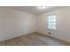 This bedroom features sleek hardwood floors and a window for natural light at 4639 Hardwood Rd, Stone Mountain, GA 30083