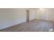 Bright bedroom features light wood flooring, closet, and fresh white paint at 4639 Hardwood Rd, Stone Mountain, GA 30083