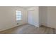 This bedroom features sleek hardwood floors, closet and a window for natural light at 4639 Hardwood Rd, Stone Mountain, GA 30083