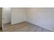 This bedroom features sleek hardwood floors, and a doorway at 4639 Hardwood Rd, Stone Mountain, GA 30083
