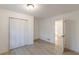 A bright bedroom with sleek hardwood floors, closet and a window, offering ample space at 4639 Hardwood Rd, Stone Mountain, GA 30083