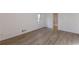 This bedroom has wood-look flooring, white walls and trim, plus a window at 4639 Hardwood Rd, Stone Mountain, GA 30083