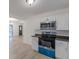 Stylish kitchen with stainless steel appliances, modern cabinetry, and new flooring throughout at 4639 Hardwood Rd, Stone Mountain, GA 30083