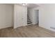 Bright living area features modern flooring and fresh white paint, showcasing stairs leading to the upper level at 4639 Hardwood Rd, Stone Mountain, GA 30083