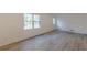 Bright living room with wood floors, a door and window at 4639 Hardwood Rd, Stone Mountain, GA 30083
