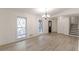 Bright living area featuring new floors, ample natural light, and stairs to the upper level, creating a welcoming space at 4639 Hardwood Rd, Stone Mountain, GA 30083