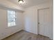 Bright room with a window providing natural light and a clean, modern aesthetic with new flooring at 4639 Hardwood Rd, Stone Mountain, GA 30083