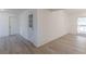 Bright room featuring fresh white walls, new flooring, and natural light from the window at 4639 Hardwood Rd, Stone Mountain, GA 30083