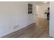 Bright room showcasing doorway and new flooring, with kitchen in the background at 4639 Hardwood Rd, Stone Mountain, GA 30083