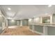 Finished basement with carpet, wet bar, recessed lighting, and plenty of natural light at 8345 Jett Ferry Rd, Sandy Springs, GA 30350