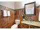 Stylish powder room with unique glass bowl sink, designer mirror, and custom tile work at 8345 Jett Ferry Rd, Sandy Springs, GA 30350