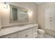 Bright bathroom with white cabinets, granite counters, and elegant fixtures at 8345 Jett Ferry Rd, Sandy Springs, GA 30350