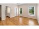 Spacious bedroom with hardwood floors and lots of natural light at 8345 Jett Ferry Rd, Sandy Springs, GA 30350