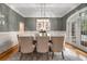 Stylish dining area bathed in natural light, featuring modern lighting and a serene ambiance at 8345 Jett Ferry Rd, Sandy Springs, GA 30350