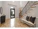 Grand foyer showcasing decorative tile flooring and a staircase with ornate iron railing at 8345 Jett Ferry Rd, Sandy Springs, GA 30350