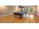 Spacious game room featuring a pool table and access to the outdoor area at 8345 Jett Ferry Rd, Sandy Springs, GA 30350