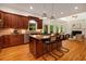 Spacious kitchen with island and bar seating flows into a bright living room, ideal for entertaining at 8345 Jett Ferry Rd, Sandy Springs, GA 30350